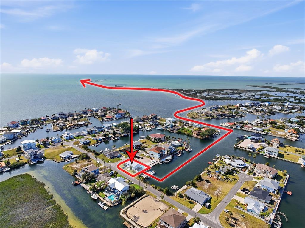This aerial view shows a waterfront house with a pool and a marked path — 3173 GULFVIEW DRIVE, HERNANDO BEACH, FL