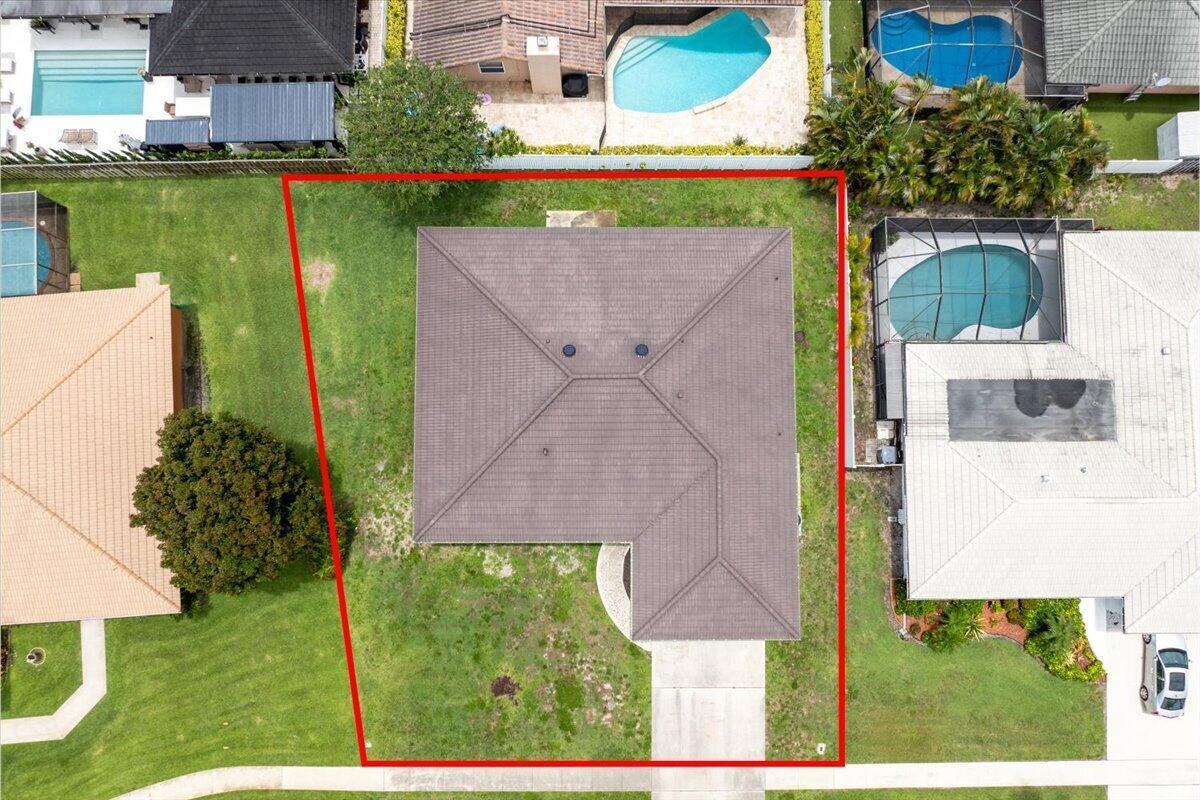 An aerial view shows a house with a brown roof on a trapezoidal residential lot — 6897 Terra Tranquila Drive, Boca Raton FL 33433, BOCA RATON, FL