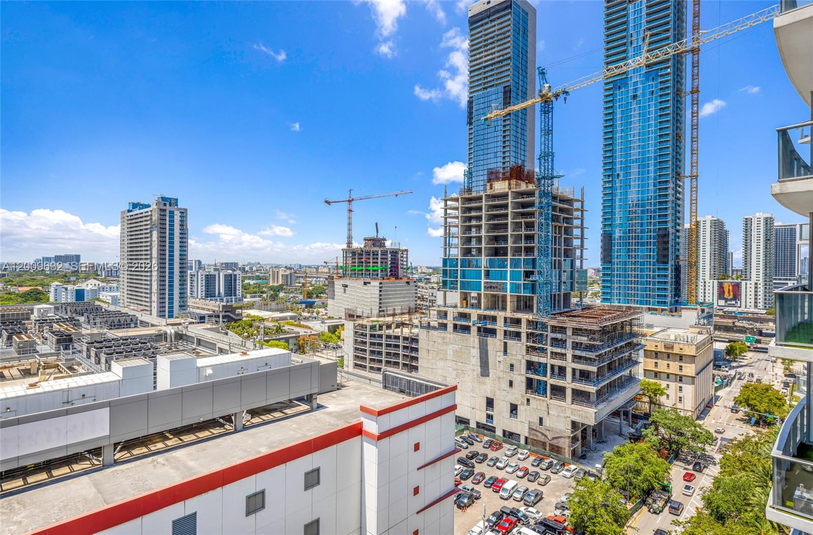 An elevated view shows a city skyline featuring several high-rise buildings and active construction sites — 851 NE 1st Ave # 1408, Miami FL 33132, MIAMI, FL