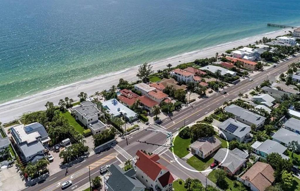 An aerial view shows a coastal neighborhood with a house circled near a beach road — 16101 GULF BOULEVARD, REDINGTON BEACH, FL