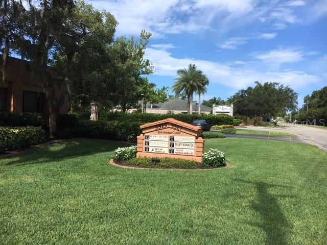 A monument sign for an office center sits on a grassy lawn near trees — 5515 21ST AVENUE W UNIT Suite D, BRADENTON, FL