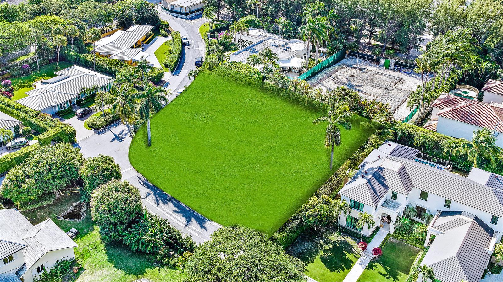 An aerial view shows a vacant, grass-covered residential lot surrounded by houses and trees — 202 Coral Lane, Palm Beach FL 33480, PALM BEACH, FL
