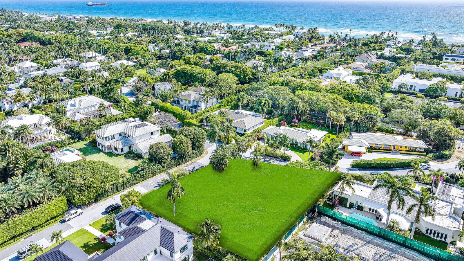 An aerial view shows a large, vacant rectangular grass lot surrounded by luxury residential homes — 202 Coral Lane, Palm Beach FL 33480, PALM BEACH, FL