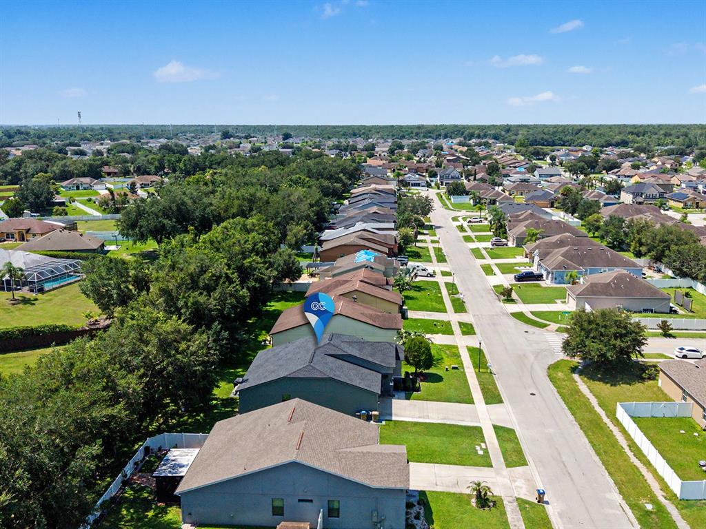 An aerial view shows a residential street with suburban houses and a blue location marker — 4824 ASHURST STREET, KISSIMMEE, FL
