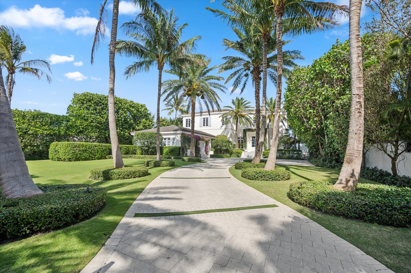 A paved driveway leads to a white two-story house surrounded by palm trees and landscaping — 3501 N Ocean Boulevard, Gulf Stream FL 33483, GULF STREAM, FL