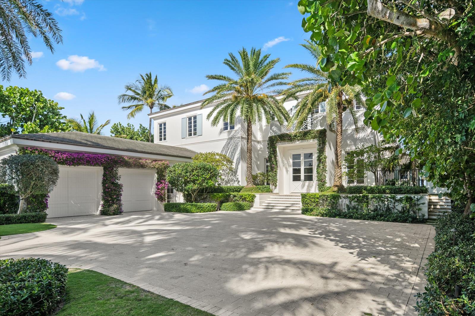A white two-story house with a paved driveway, palm trees, and a two-car garage — 3501 N Ocean Boulevard, Gulf Stream FL 33483, GULF STREAM, FL