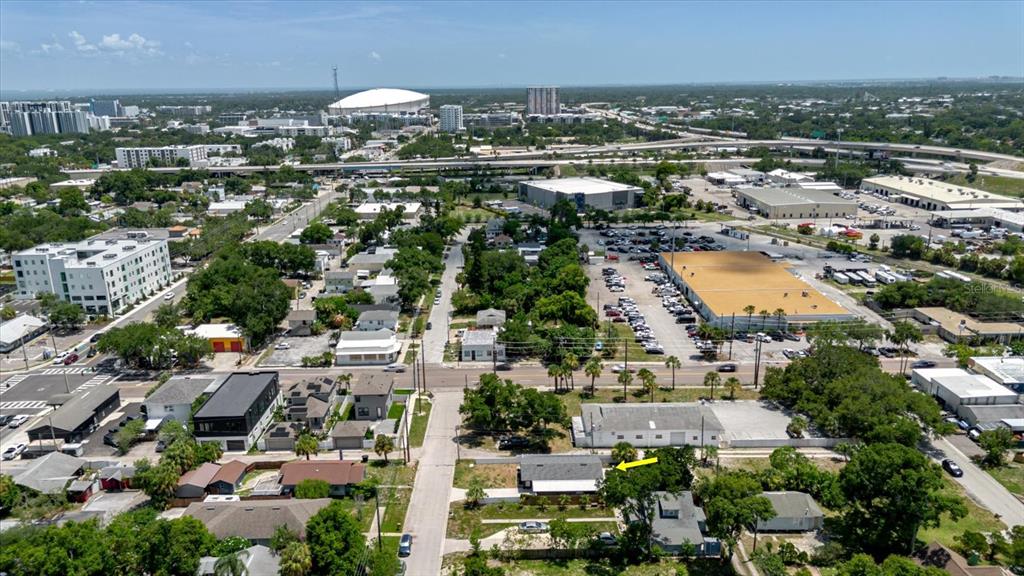 An aerial view shows a residential property with a yellow arrow pointing to the house — 916 17TH STREET N, ST PETERSBURG, FL
