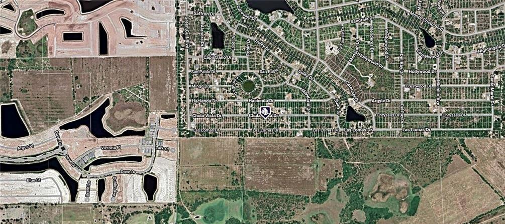 This is an aerial map view of a residential neighborhood and surrounding undeveloped land — 27173 CHULA VISTA DRIVE, PUNTA GORDA, FL