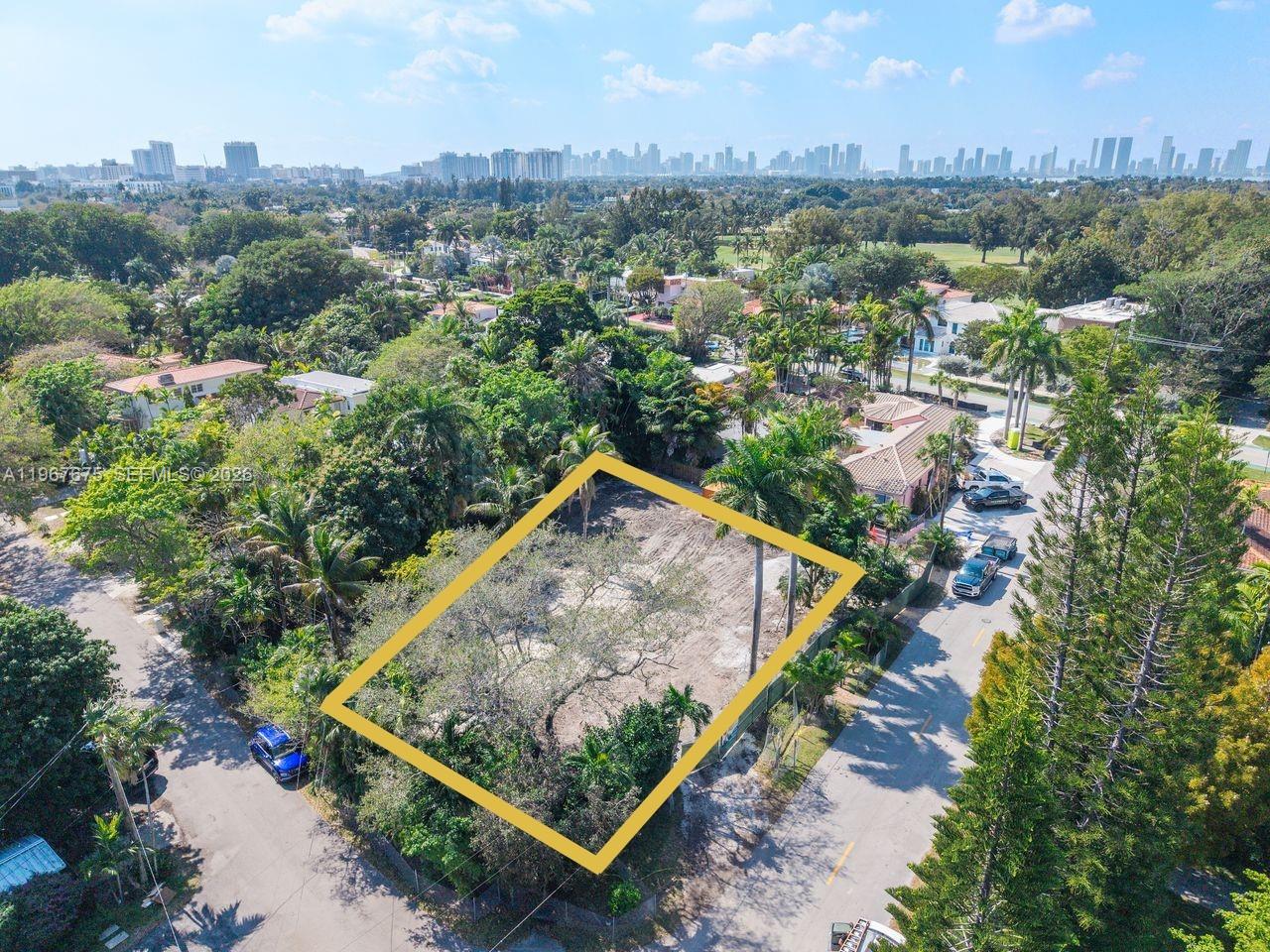 An artist rendering of a modern three-story concrete house with glass walls and lush landscaping — 2880 Fairgreen Dr, Miami Beach FL 33140, MIAMI BEACH, FL