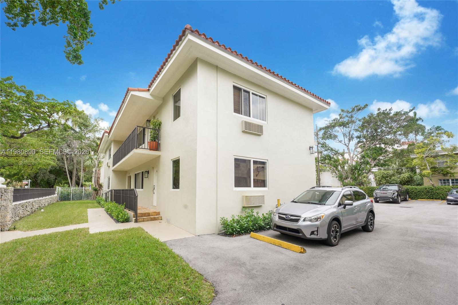 A two-story apartment building with a parking lot and a grassy lawn in front — 35 Antilla Ave, Coral Gables FL 33134, CORAL GABLES, FL