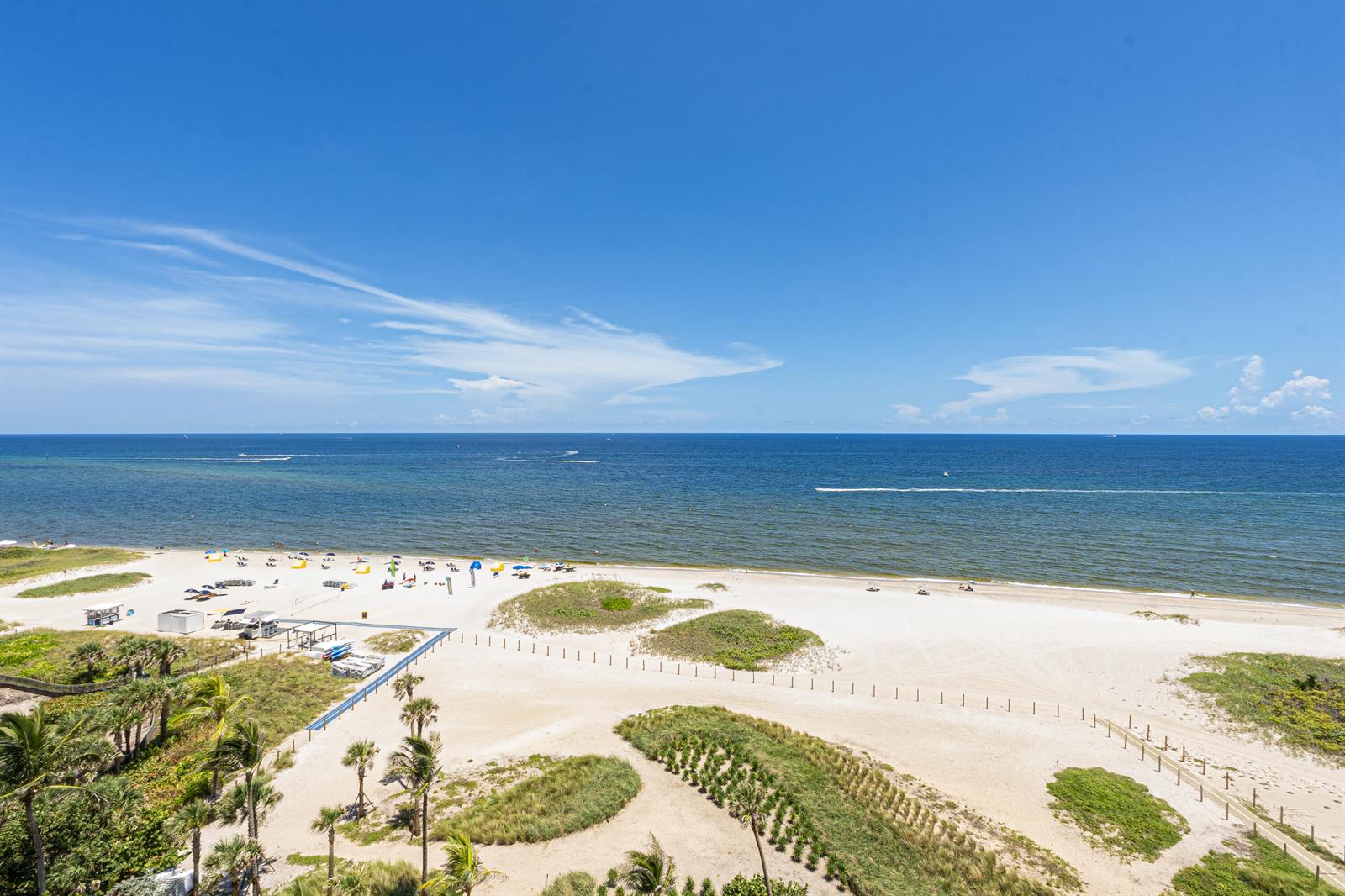 An elevated view of a sandy beach with dunes, palm trees, and the ocean — 1116 N Ocean Boulevard # 904, Pompano Beach FL 33062, POMPANO BEACH, FL