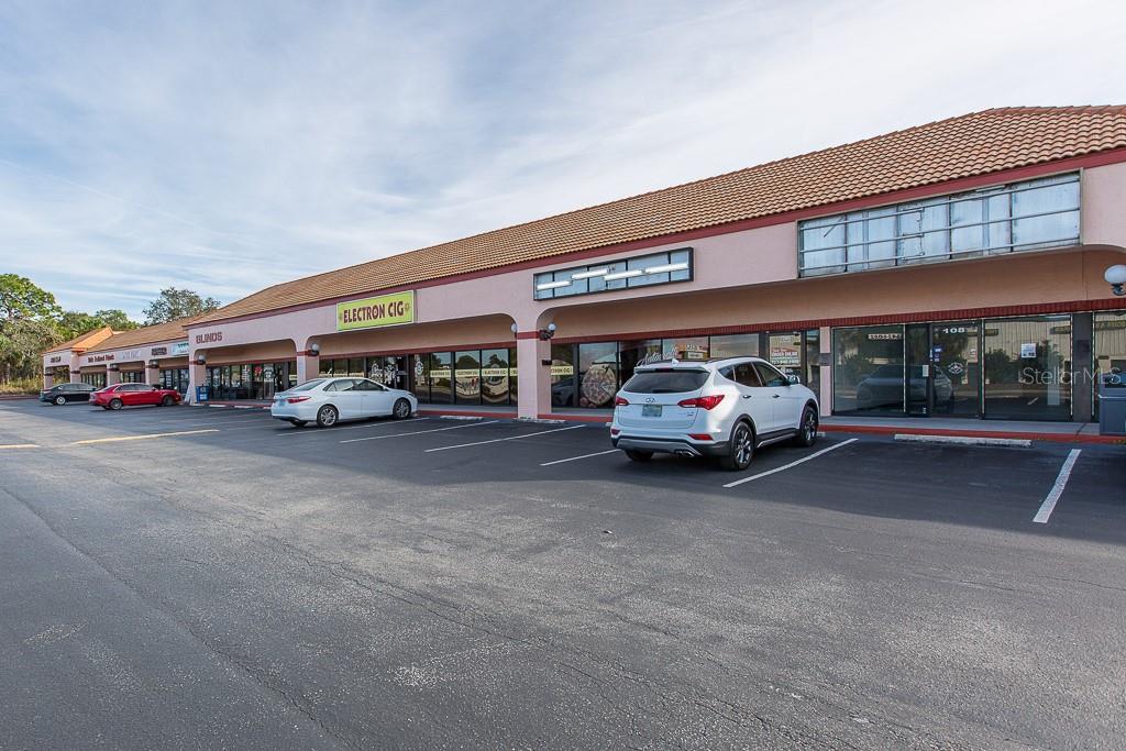 A commercial strip mall building with a Florida West Coast Credit Union storefront — 7200 RIDGE ROAD, PORT RICHEY, FL