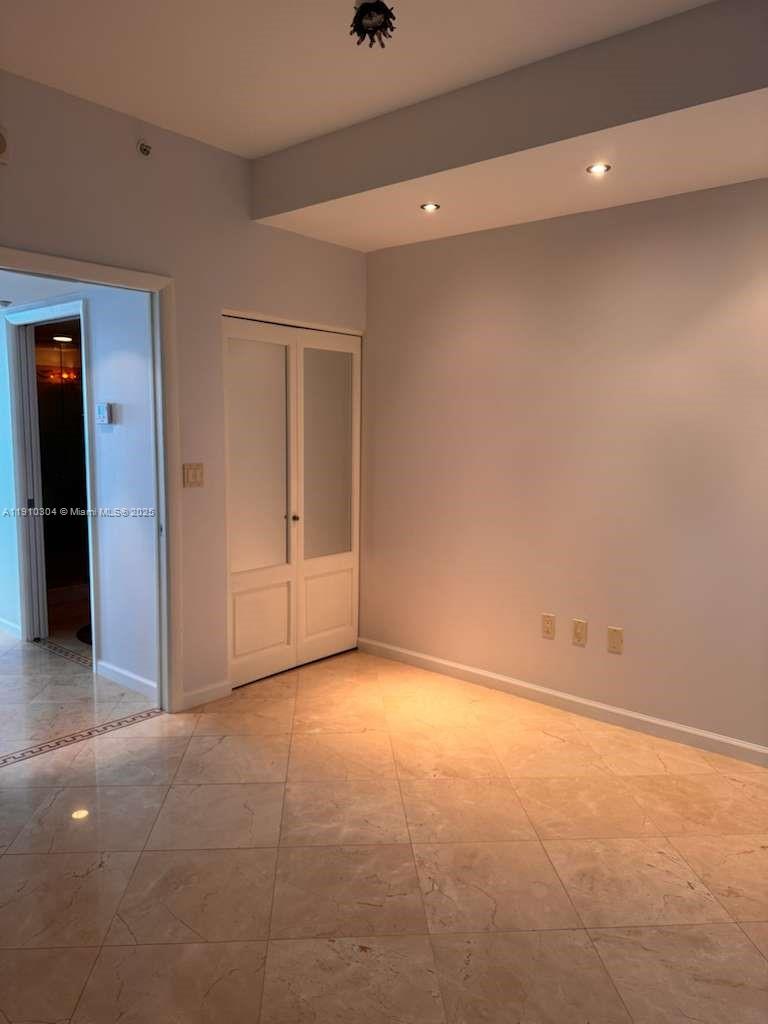 A room with light-colored walls, recessed ceiling lighting, and beige tile flooring — 5025 Collins Ave # 1602, Miami Beach FL 33140, MIAMI BEACH, FL