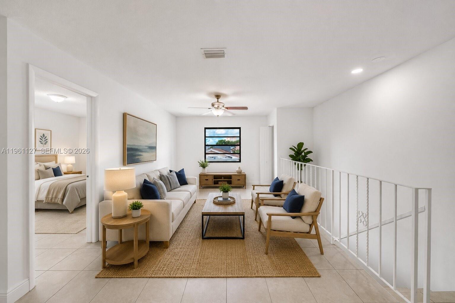 A living room features a beige sofa, two armchairs, a coffee table, and a rug — 1283 W 42nd St # 2, Hialeah FL 33012, HIALEAH, FL