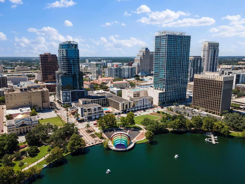 An aerial view of the Orlando skyline featuring Lake Eola and the iconic rainbow band shell — 150 E ROBINSON STREET UNIT 3409, ORLANDO, FL