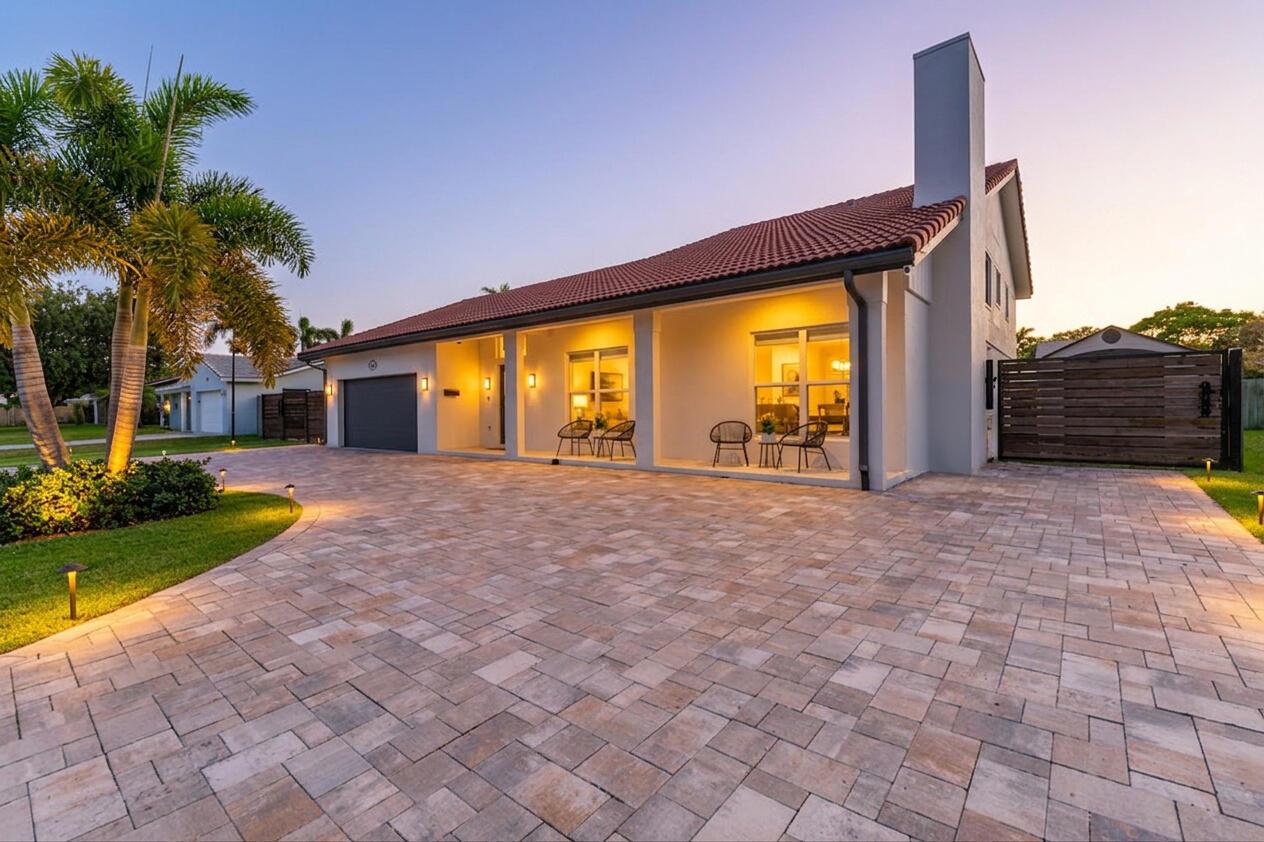 A single-story house with a tiled roof, paved driveway, and a covered front porch — 1472 SW 13th Street, Boca Raton FL 33486, BOCA RATON, FL