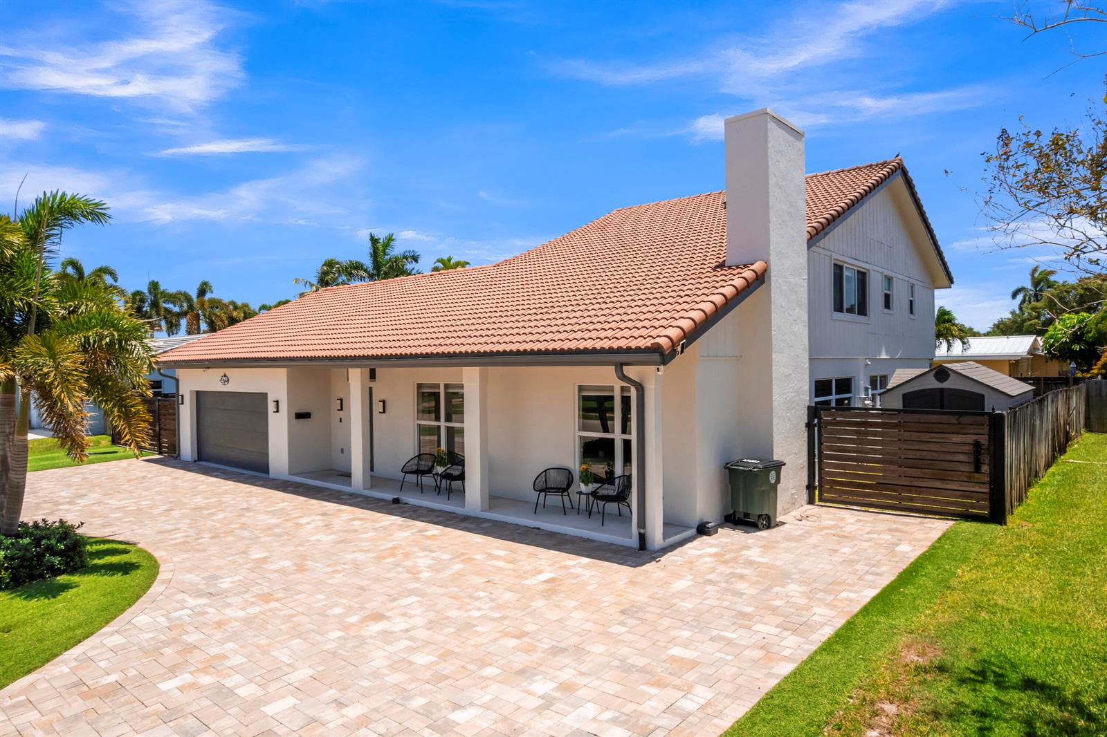 A single-story house with a tiled roof, white exterior, and a paved driveway — 1472 SW 13th Street, Boca Raton FL 33486, BOCA RATON, FL