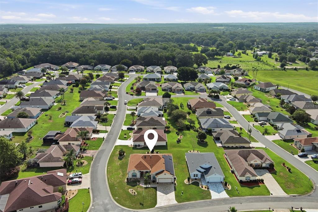 An aerial view shows a suburban neighborhood with single-family homes and a marked property — 17790 SE 125TH CIRCLE, SUMMERFIELD, FL