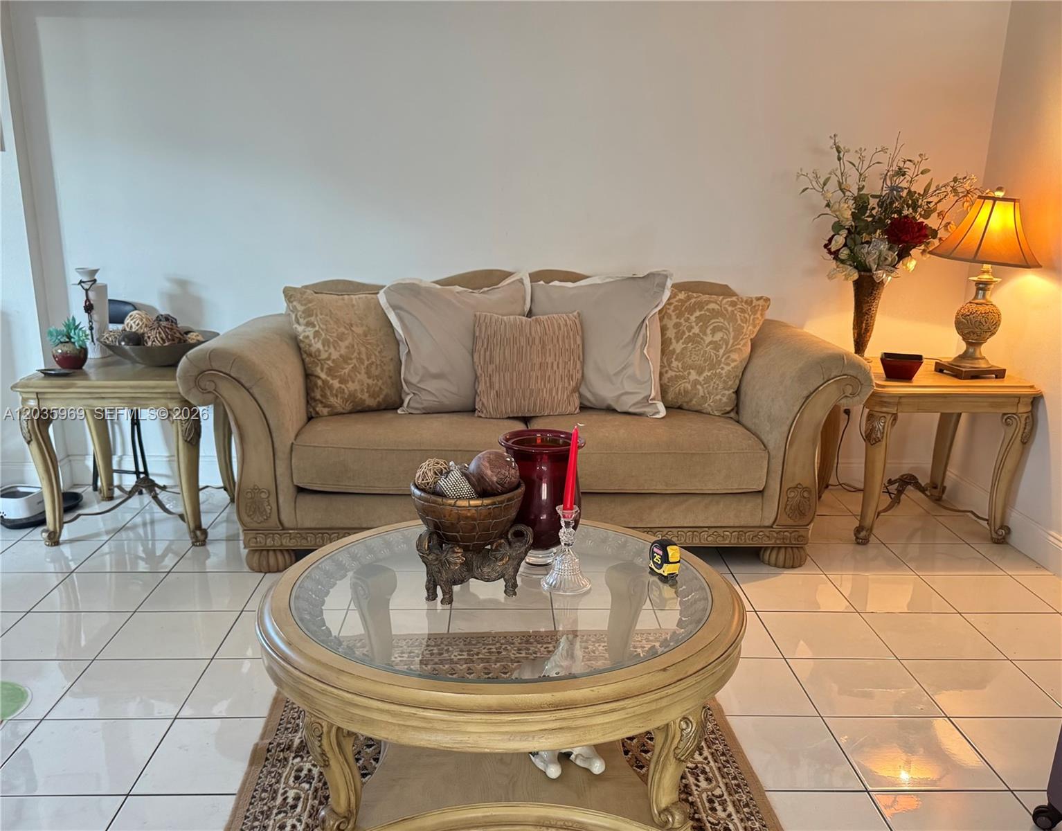 A living room features a beige sofa, a glass-topped coffee table, and two side tables — 13326 SW 9th Ter, Miami FL 33184, MIAMI, FL
