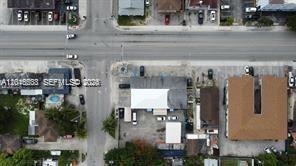 This aerial view shows a commercial building with a parking lot near a street intersection — 918 E 2nd Ave, Hialeah FL 33010, HIALEAH, FL