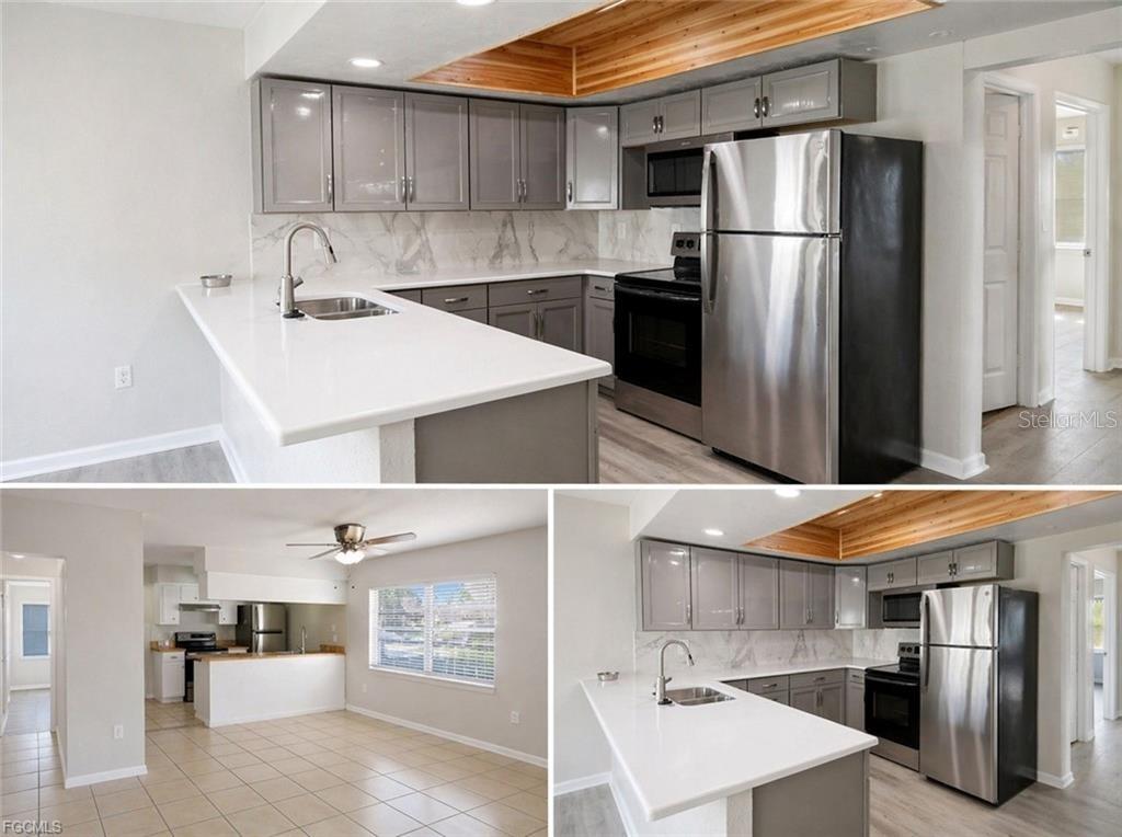 A kitchen features gray cabinets, white countertops, stainless steel appliances, and a wood-paneled ceiling accent — 4015 SE 19TH AVENUE UNIT 5-9, CAPE CORAL, FL