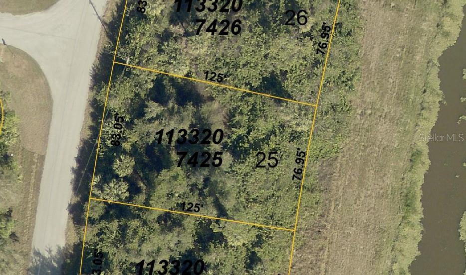 This is an aerial map showing property lot lines and dimensions for a wooded parcel — BARCELONA DRIVE, NORTH PORT, FL
