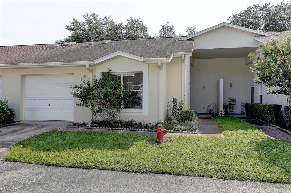 A single-story house with a white garage, a front window, and a red fire hydrant — 8405 TERRACE MEADOWS COURT UNIT 8405, TEMPLE TERRACE, FL