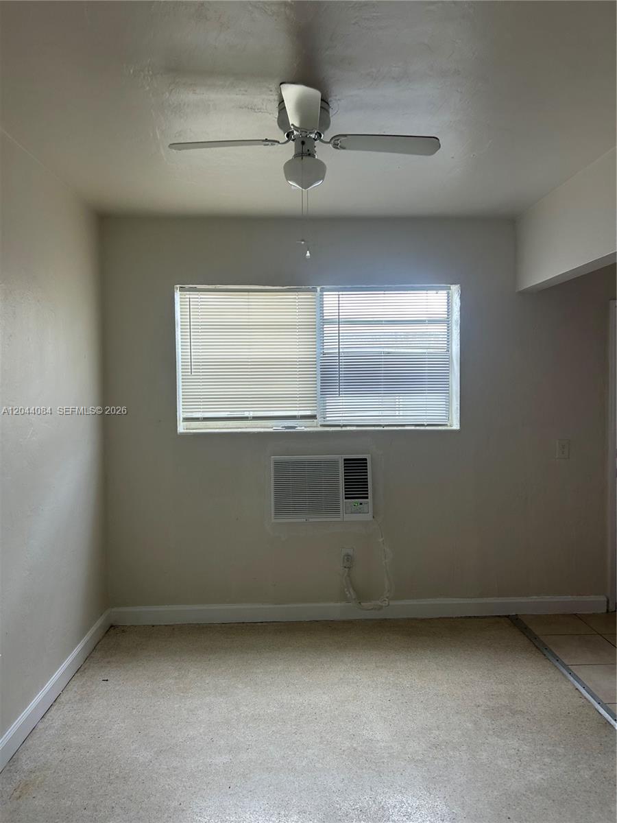 A room features a ceiling fan, a window with blinds, and a wall-mounted air conditioner — 730 83rd St # 2, Miami Beach FL 33141, MIAMI BEACH, FL