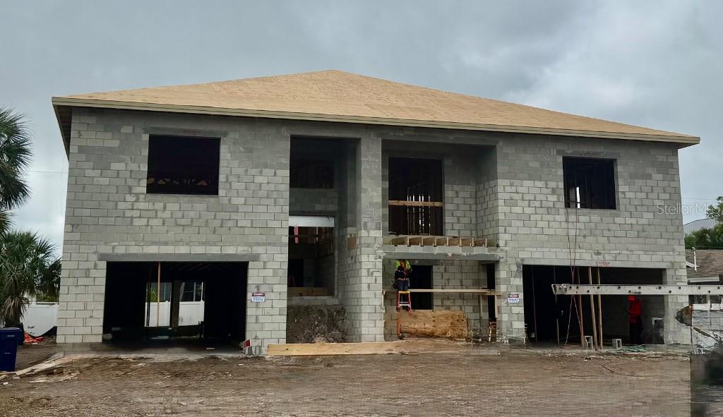 A two-story house under construction with concrete block walls and a plywood roof deck — 104 18TH STREET, BELLEAIR BEACH, FL