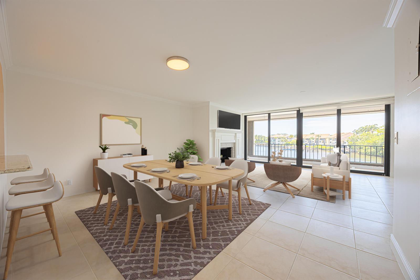 A dining area and living room with tile floors, a fireplace, and a balcony view — 801 Palm Trail # 9, Delray Beach FL 33483, DELRAY BEACH, FL