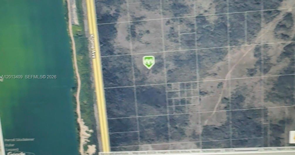 This is a satellite map view showing a vacant plot of land near Krome Avenue — KROME AVE, Miami FL 33185, MIAMI, FL