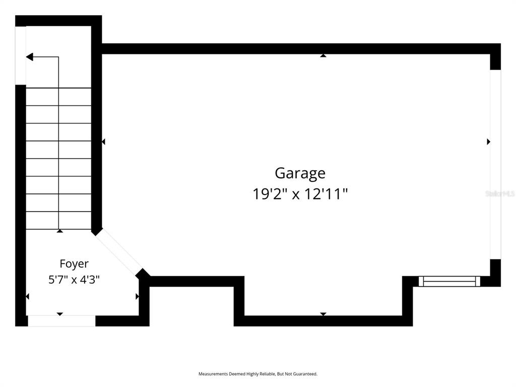 This is a floor plan showing a garage and a foyer with stairs — 1491 MAHOGANY LANE UNIT 1491, PALM HARBOR, FL