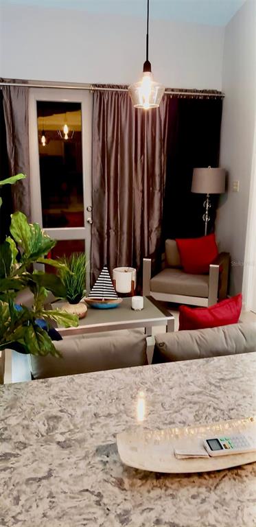 A living area features a gray sofa, a coffee table, and a chair with red pillows — Carr. PR 307 km 8.5 BOQUERÓN BAY SIDE INC APT #23, CABO ROJO, PR