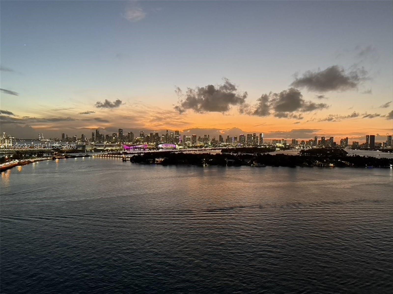 A wide-angle view of the Miami skyline across the water at sunset — 540 West Ave # 2011, Miami Beach FL 33139, MIAMI BEACH, FL