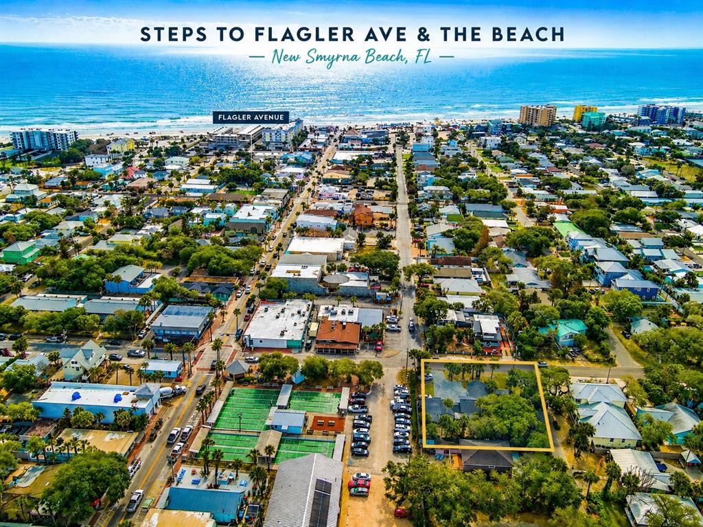 An aerial view of a coastal town with a highlighted property near the beach — 200 S PINE STREET, NEW SMYRNA BEACH, FL