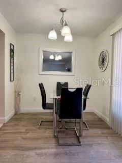 A hallway with tiled floors leads to a bedroom doorway between two sets of closet doors — 4743 S TEXAS AVENUE UNIT 4743B, ORLANDO, FL
