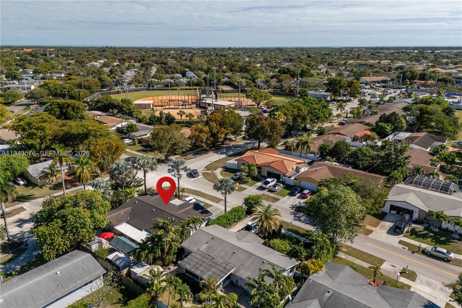An aerial view shows a residential neighborhood with a marked house and a baseball field — 20150 SW 89th Ct, Cutler Bay FL 33189, CUTLER BAY, FL