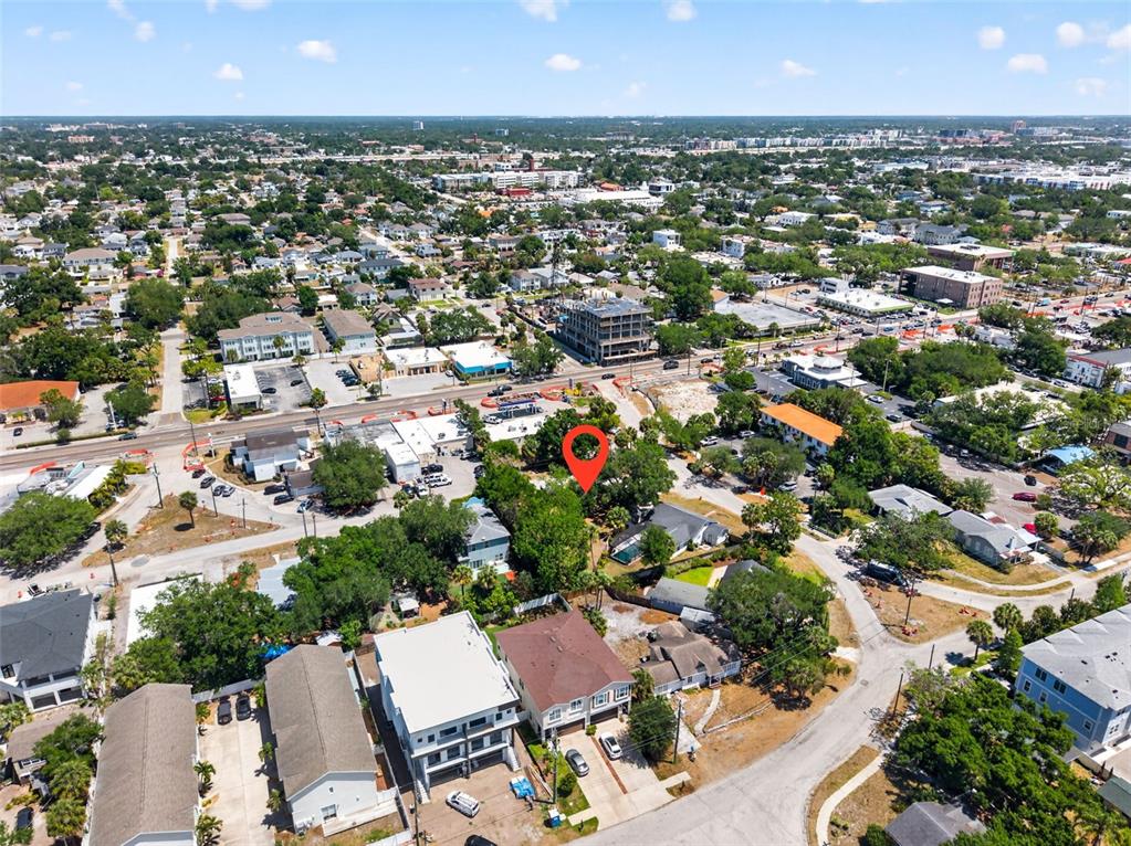 An aerial view shows a residential neighborhood with a red location pin marking a lot — 2604 N CLEVELAND STREET, TAMPA, FL