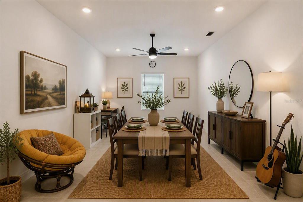 A dining room features a wooden table, six chairs, a rug, and a circular wall mirror — 1699 MEADOWLARK DRIVE, DELTONA, FL