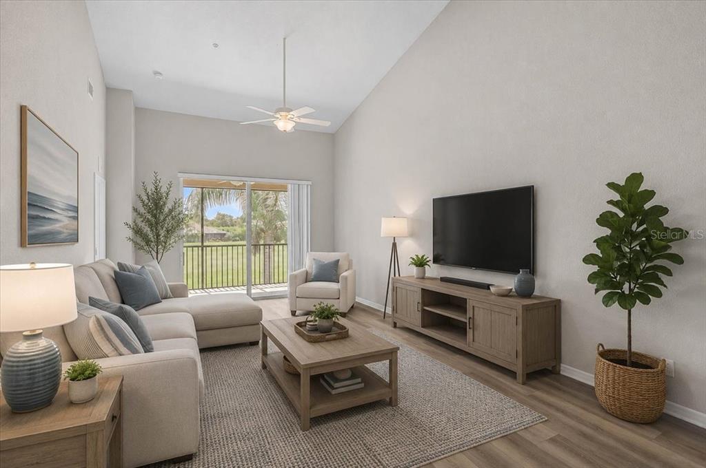 A living room features a sectional sofa, coffee table, media console, and a balcony view — 915 FAIRWAYCOVE LANE UNIT 201, BRADENTON, FL