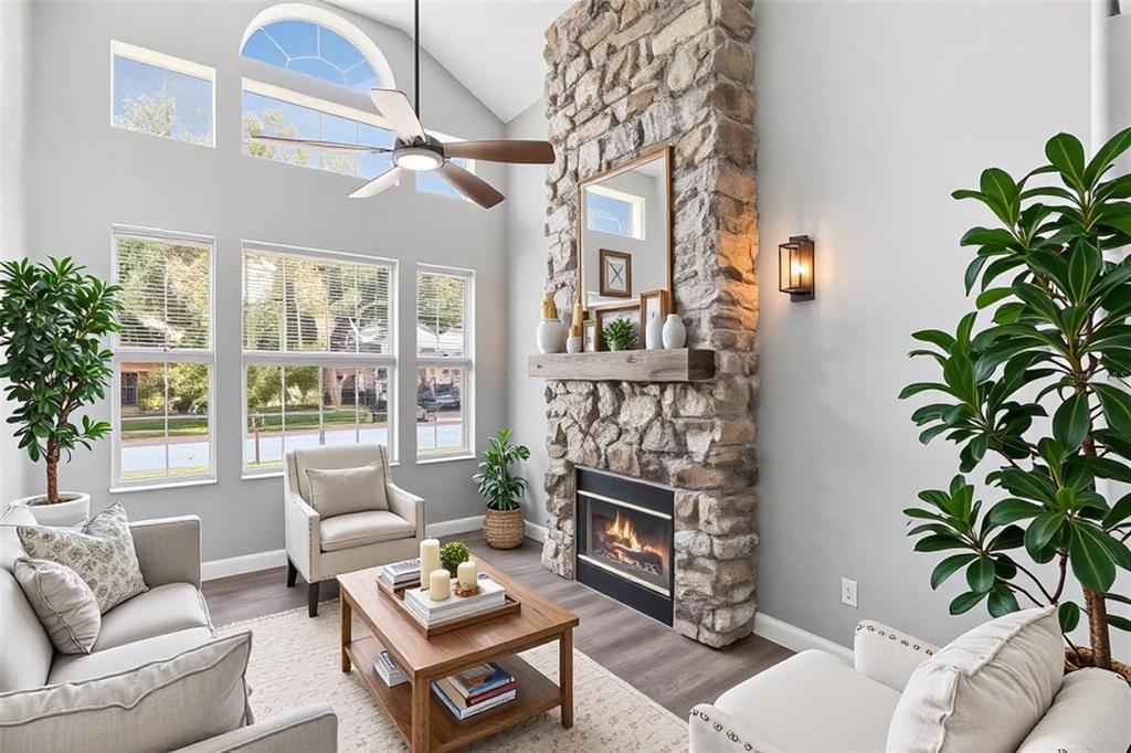 A blue front door is framed by stone-clad pillars under a covered entryway — 2743 RUNNING SPRINGS LOOP, OVIEDO, FL