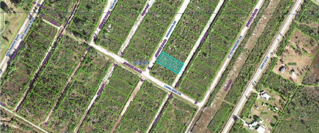 This is an aerial map showing a highlighted rectangular land parcel at a road intersection — SARASOTA DRIVE, INDIAN LAKE ESTATES, FL