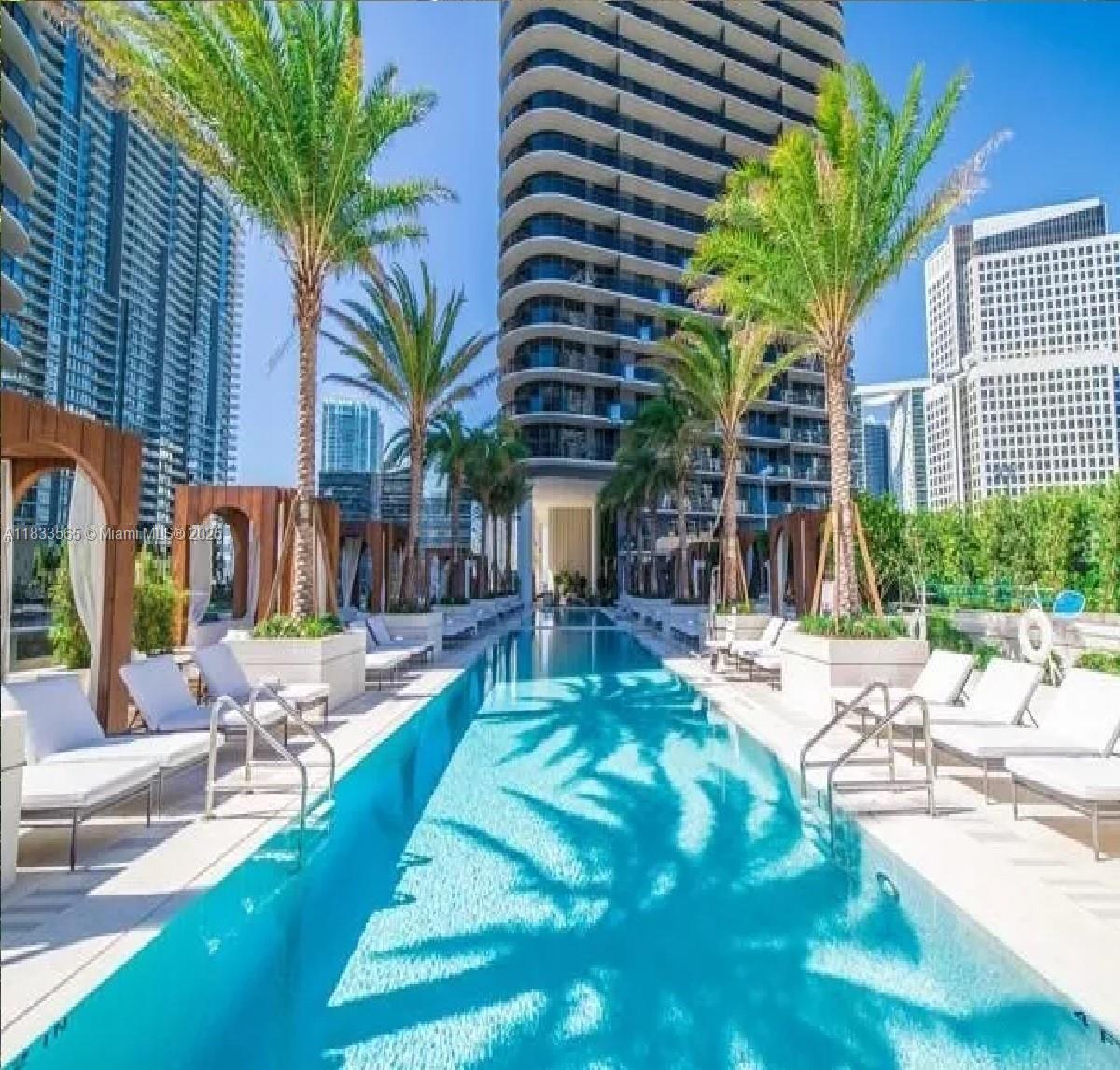 This rendering shows a luxury spa room with a sauna, hot tub, and city views — 801 S Miami Ave # 4204, Miami FL 33130, MIAMI, FL