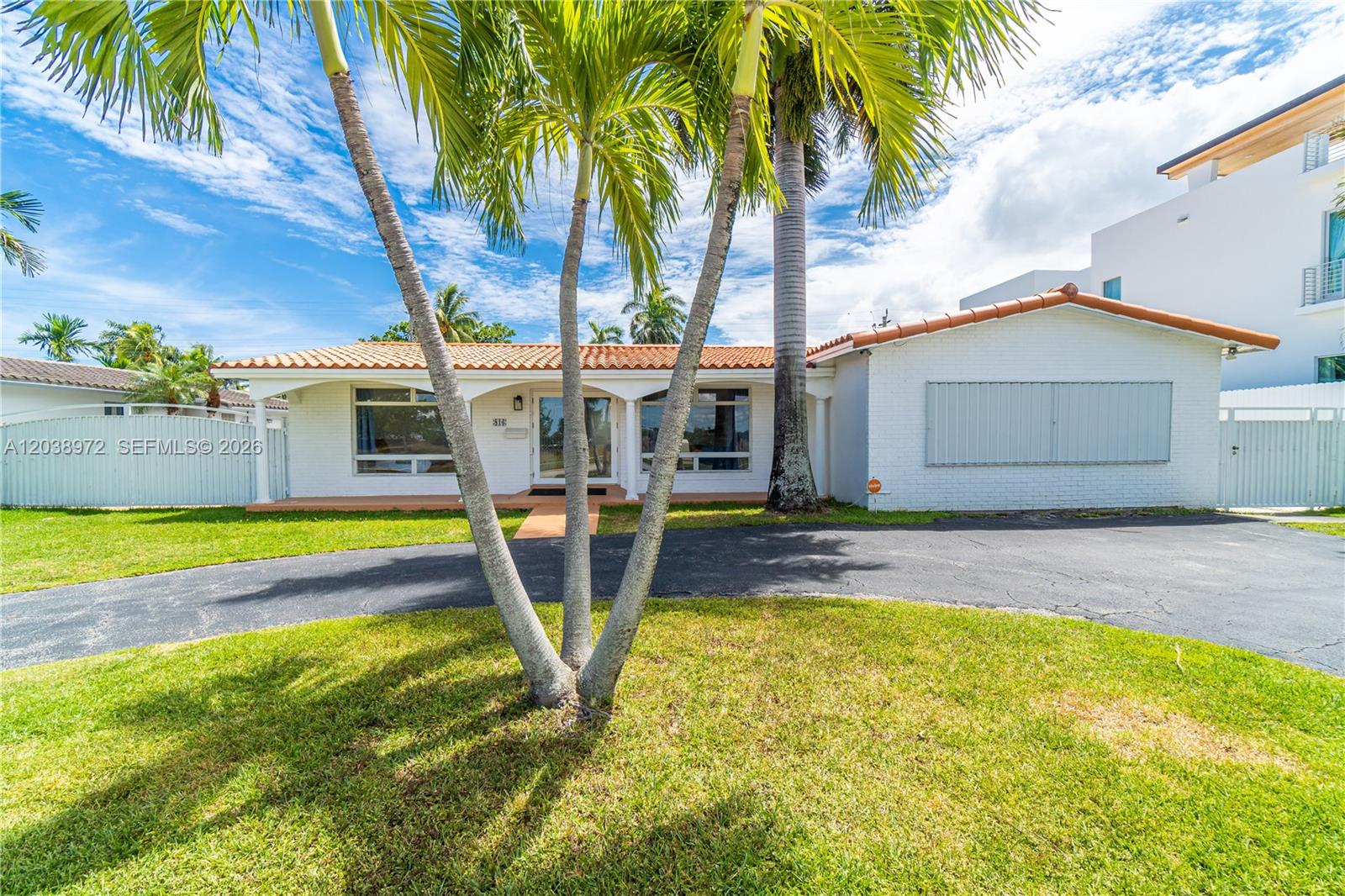 A single-story white house with a tiled roof and a curved driveway — 816 Polk St # 1, Hollywood FL 33019, HOLLYWOOD, FL