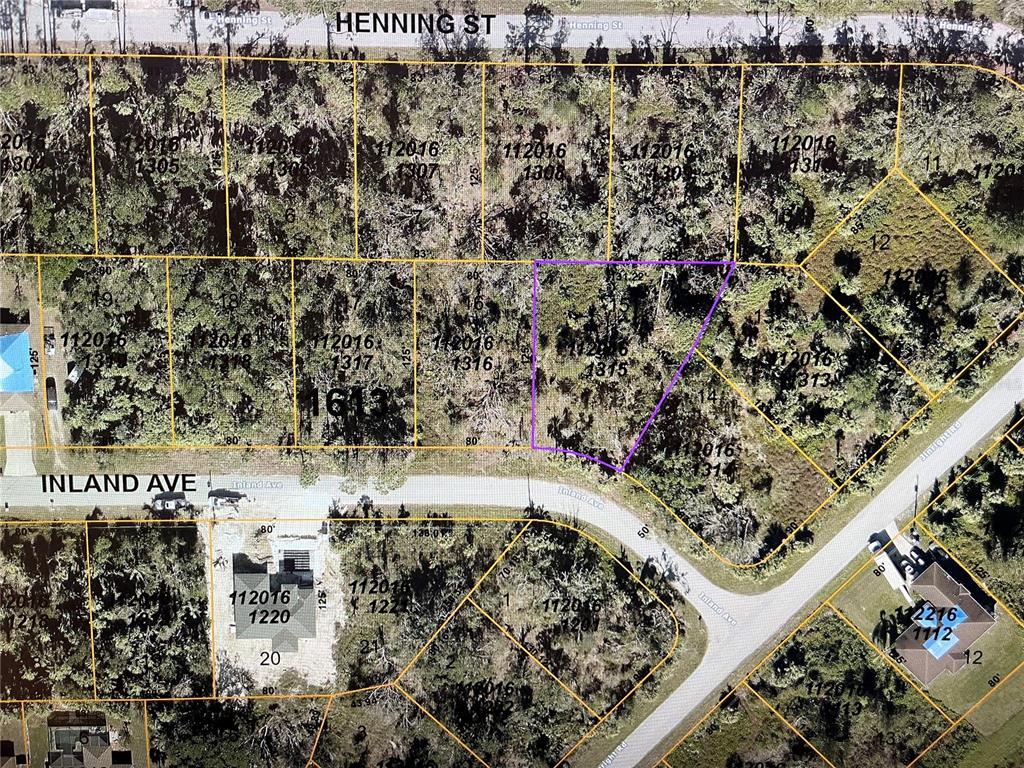 This is a satellite map showing property lot lines and parcel numbers in a residential area — LOT 15 INLAND AVENUE, NORTH PORT, FL