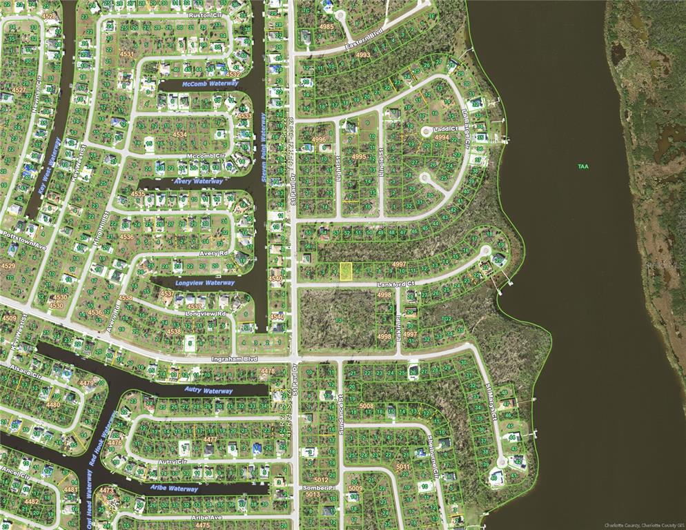 This is an aerial map of a residential neighborhood with waterways and undeveloped lots — 16042 LANKFORD COURT, PORT CHARLOTTE, FL
