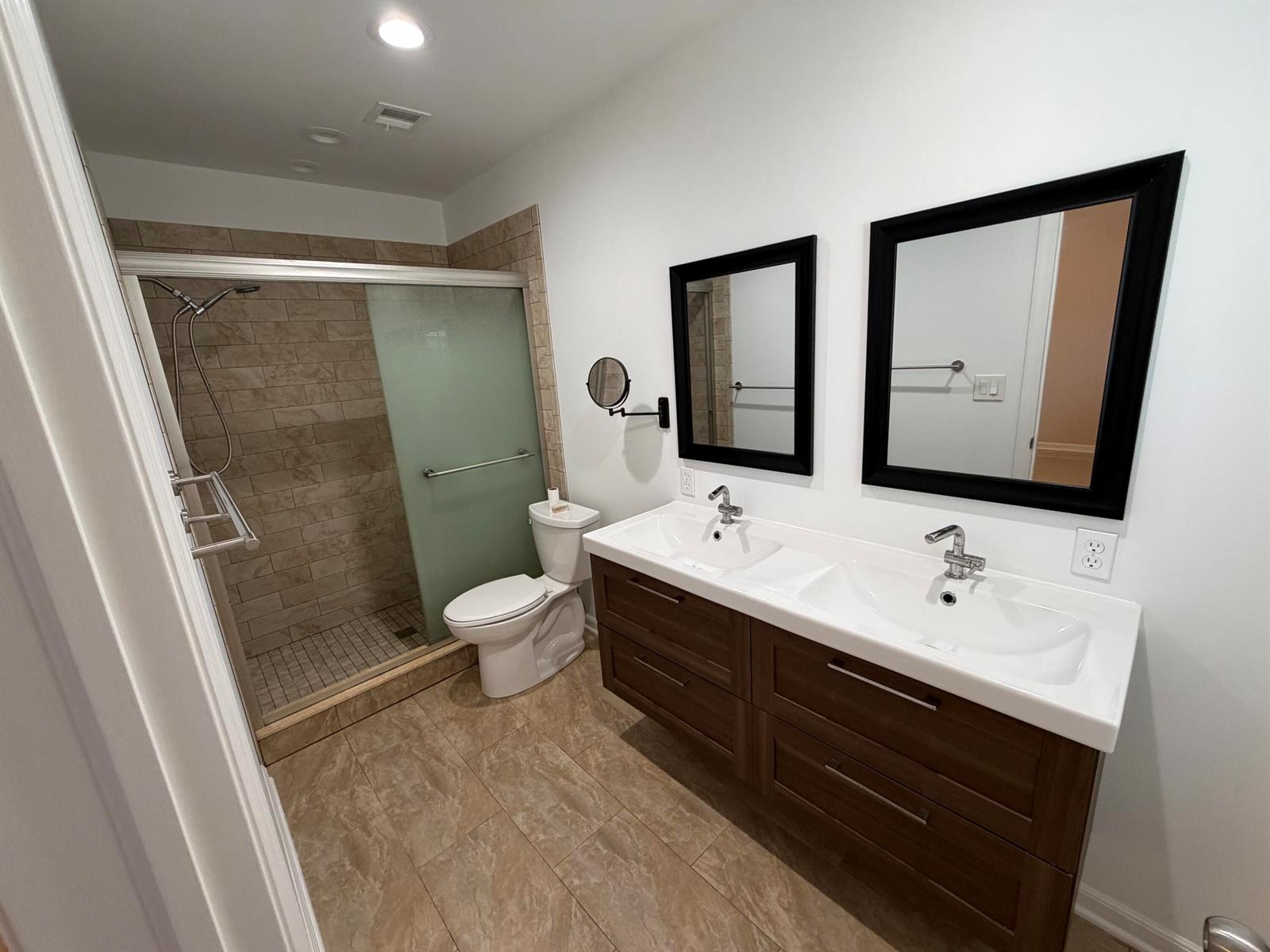 A bathroom features a double vanity, a walk-in tiled shower, and a toilet — 499 W Conference Drive, Boca Raton FL 33486, BOCA RATON, FL