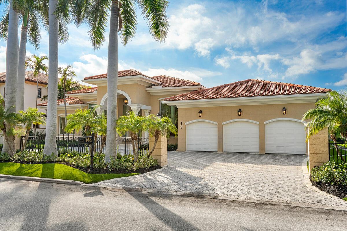 A single-story house with a three-car garage, tile roof, and palm trees in the front — 533 E Alexander Palm Road, Boca Raton FL 33432, BOCA RATON, FL