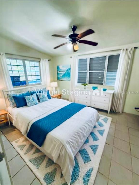 A bedroom features a queen bed with blue accents, a ceiling fan, and tiled floors — KM 5.0 906, YABUCOA, PR