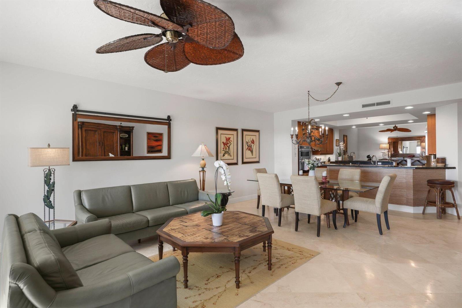 A living and dining area with leather sofas, a wooden coffee table, and tile floors — 500 S Us Highway 1 # 202, Jupiter FL 33477, JUPITER, FL